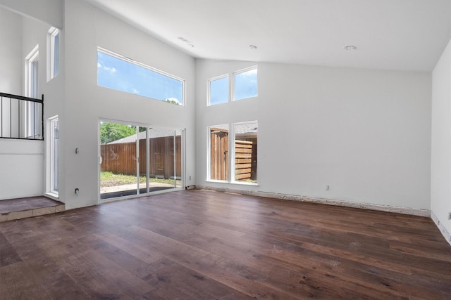 4209 Brooktree Ln, Dallas, TX 75287 - unfurnished living room with wood finished floors and a towering ceiling