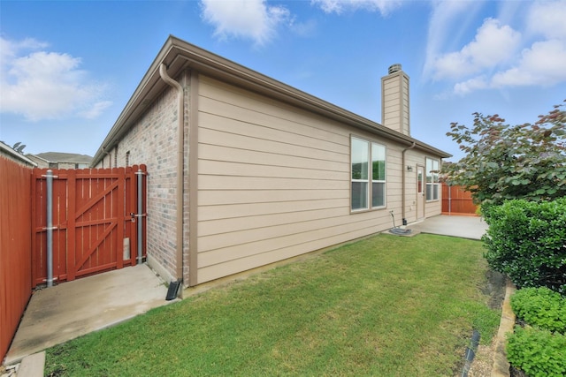 7732 Anatolian Way, Fort Worth, TX 76131 - view of side of home with a gate, a chimney, a patio, and brick siding