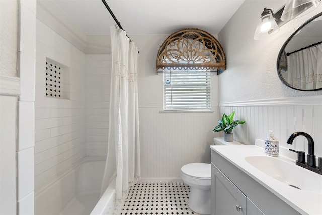 1905 S 51st St, Temple, TX 76504 - bathroom with a wainscoted wall, vanity, and shower / bath combination with curtain
