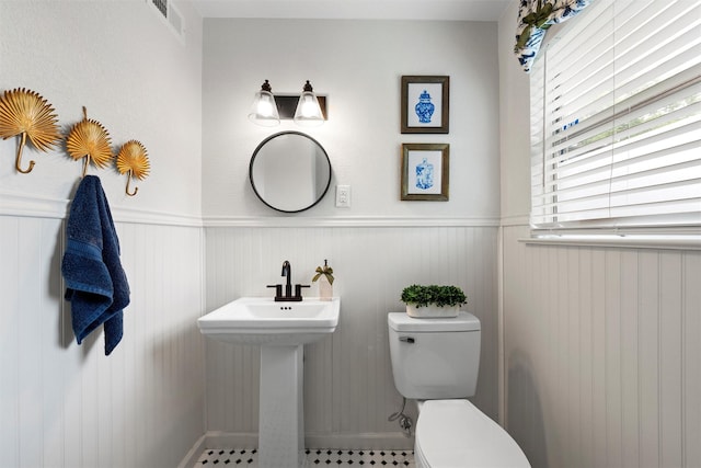 1905 S 51st St, Temple, TX 76504 - bathroom with toilet and wainscoting
