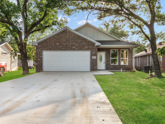 1510 N Wilhite St, Cleburne, TX 76031 - view of front of property with brick siding, a garage, concrete driveway, and a front lawn