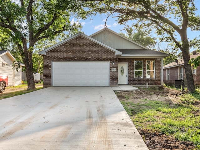 1510 N Wilhite St, Cleburne, TX 76031 - view of front of house featuring brick siding, an attached garage, and driveway