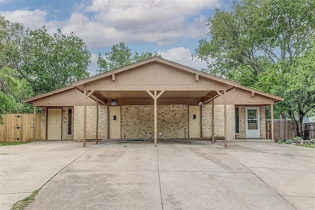 5020 Donnelly Ave Unit 5022, Fort Worth, TX 76107 - mid-century home featuring concrete driveway, a carport, and brick siding