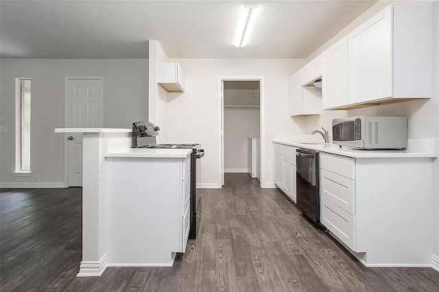 5020 Donnelly Ave Unit 5022, Fort Worth, TX 76107 - kitchen with stainless steel range with electric stovetop, white microwave, dishwasher, dark wood-type flooring, and light countertops