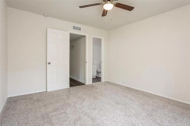 5020 Donnelly Ave Unit 5022, Fort Worth, TX 76107 - unfurnished bedroom with dark colored carpet, a ceiling fan, and connected bathroom