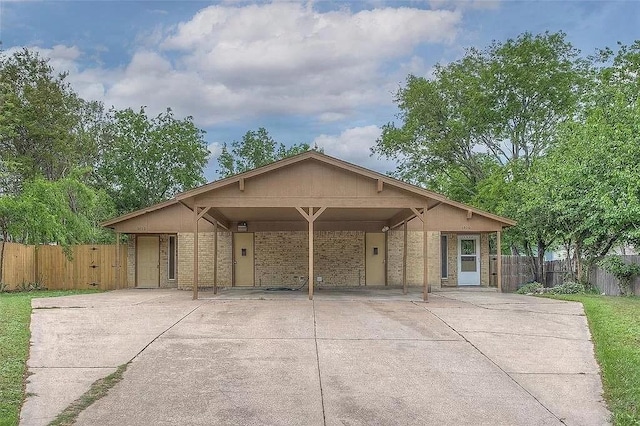 5020 Donnelly Ave Unit 5022, Fort Worth, TX 76107 - view of front facade with concrete driveway, a carport, and brick siding