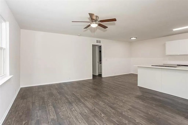 5020 Donnelly Ave Unit 5022, Fort Worth, TX 76107 - unfurnished living room featuring a ceiling fan and dark wood-type flooring