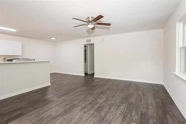 5020 Donnelly Ave Unit 5022, Fort Worth, TX 76107 - unfurnished living room with dark wood-type flooring and a ceiling fan
