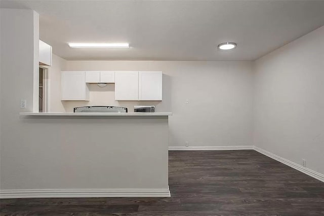 5020 Donnelly Ave Unit 5022, Fort Worth, TX 76107 - kitchen featuring white cabinetry, dark wood finished floors, stove, and light countertops