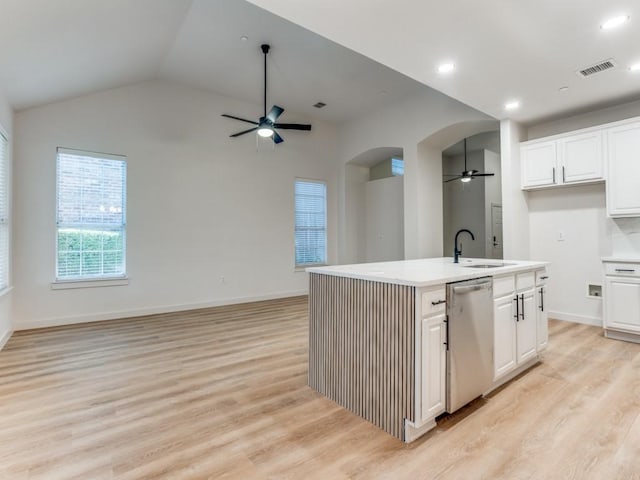 9816 Clocktower Ct, Plano, TX 75025 - kitchen featuring dishwasher, a ceiling fan, open floor plan, arched walkways, and light countertops