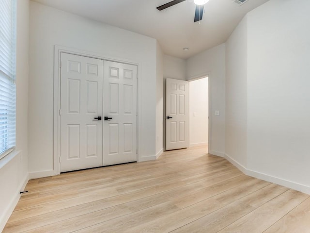 9816 Clocktower Ct, Plano, TX 75025 - unfurnished bedroom featuring light wood-type flooring, a closet, and a ceiling fan