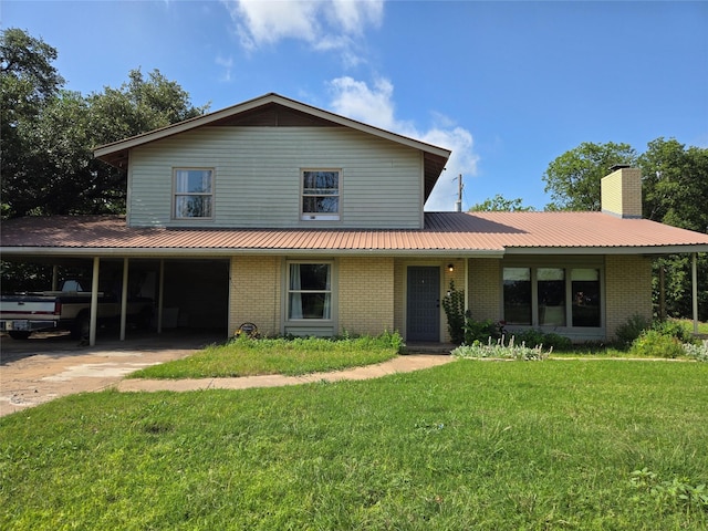 1309 W Sunset St, San Saba, TX 76877 - view of front facade featuring brick siding, a front yard, a metal roof, and a chimney