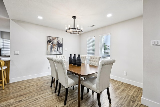 1722 Brighton Dr, Carrollton, TX 75007 - dining space featuring a chandelier, light wood-style floors, and recessed lighting