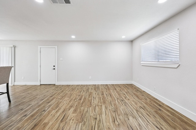1722 Brighton Dr, Carrollton, TX 75007 - empty room featuring light wood finished floors and recessed lighting