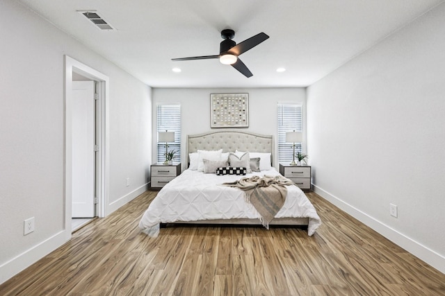 1722 Brighton Dr, Carrollton, TX 75007 - bedroom with wood finished floors, ceiling fan, and recessed lighting