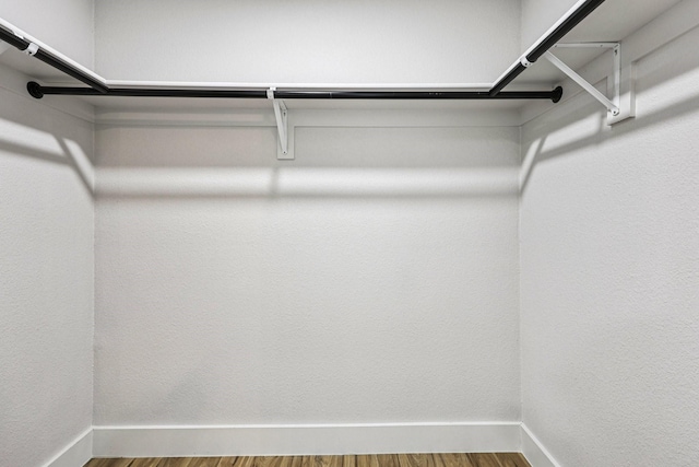 1722 Brighton Dr, Carrollton, TX 75007 - walk in closet with wood finished floors
