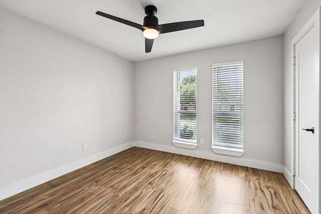 1722 Brighton Dr, Carrollton, TX 75007 - unfurnished room with wood finished floors and ceiling fan