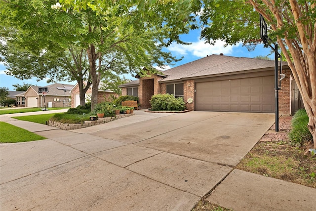 529 Cambridge Dr, Saginaw, TX 76179 - view of front facade with brick siding, an attached garage, driveway, and roof with shingles