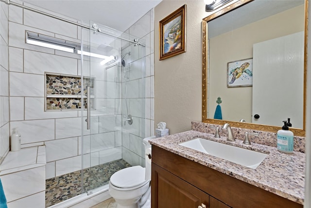 529 Cambridge Dr, Saginaw, TX 76179 - bathroom featuring vanity, a stall shower, and a textured wall