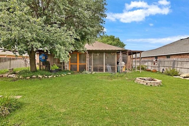 529 Cambridge Dr, Saginaw, TX 76179 - fenced backyard featuring an outdoor fire pit and a sunroom