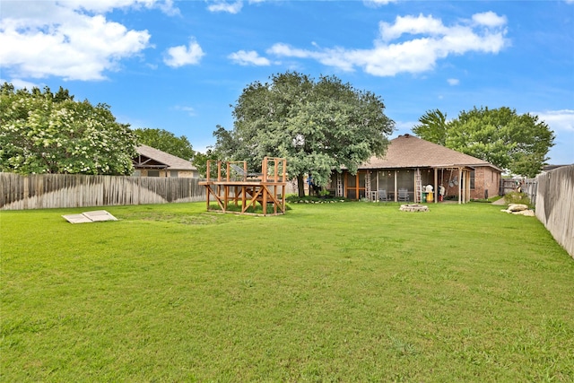 529 Cambridge Dr, Saginaw, TX 76179 - fenced backyard featuring a sunroom and a playground