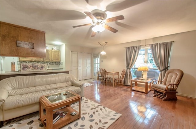 1002 Hawthorne Dr, Allen, TX 75002 - living area with wood finished floors and a ceiling fan