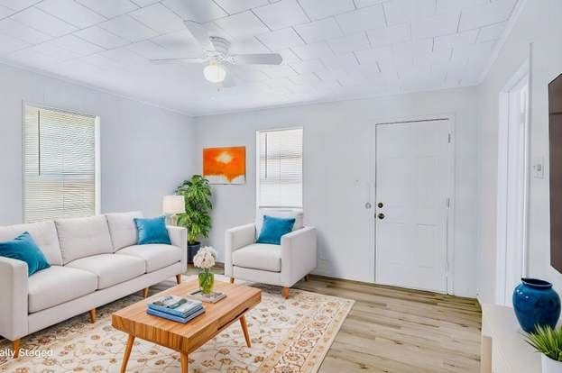 107 Quillen, Whitesboro, TX 76273 - living area with light wood-type flooring and a ceiling fan