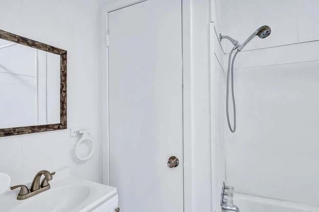 107 Quillen, Whitesboro, TX 76273 - bathroom featuring shower / bath combination and vanity