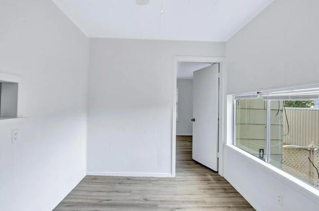 107 Quillen, Whitesboro, TX 76273 - unfurnished room featuring wood finished floors and a ceiling fan