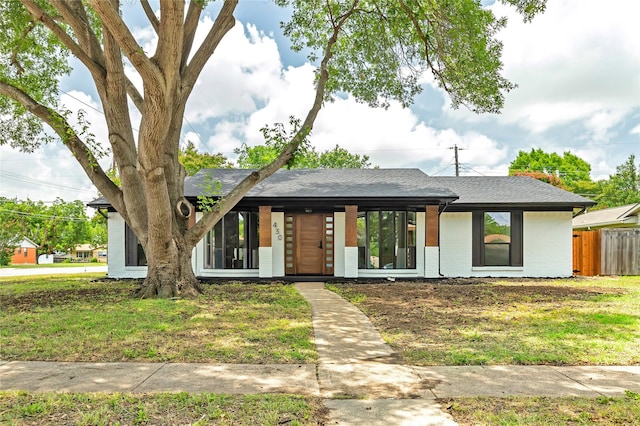 430 Cambridge Dr, Richardson, TX 75080 - view of front of home featuring brick siding and roof with shingles