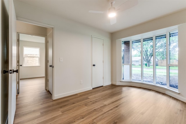 430 Cambridge Dr, Richardson, TX 75080 - empty room with light wood-type flooring and ceiling fan