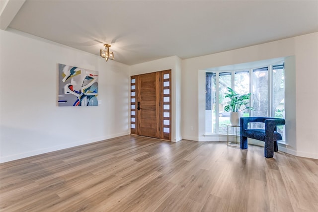 430 Cambridge Dr, Richardson, TX 75080 - foyer featuring wood finished floors and a chandelier