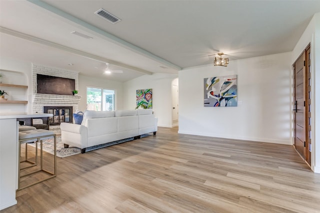 430 Cambridge Dr, Richardson, TX 75080 - living area featuring a fireplace and light wood-style floors