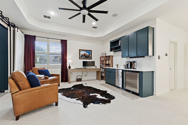 2157 Lookout Ct, Hurst, TX 76054 - living room featuring a ceiling fan, light colored carpet, a tray ceiling, crown molding, and recessed lighting