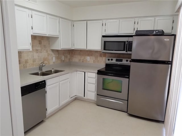 4748 Old Bent Tree Ln Unit 906, Dallas, TX 75287 - kitchen with stainless steel appliances, white cabinets, light countertops, and backsplash
