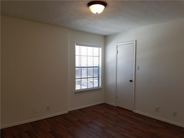 4748 Old Bent Tree Ln Unit 906, Dallas, TX 75287 - empty room with dark wood-type flooring and a textured ceiling