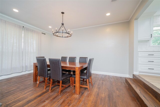 812 E 1st, Hughes Springs, TX 75656 - dining room with a chandelier, ornamental molding, wood finished floors, and recessed lighting