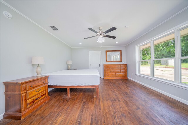 812 E 1st, Hughes Springs, TX 75656 - bedroom featuring dark wood-style floors, crown molding, a ceiling fan, and recessed lighting