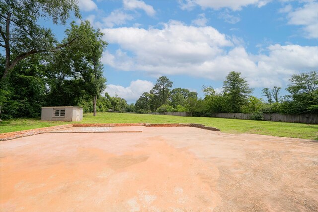 812 E 1st, Hughes Springs, TX 75656 - view of patio / terrace with a storage shed