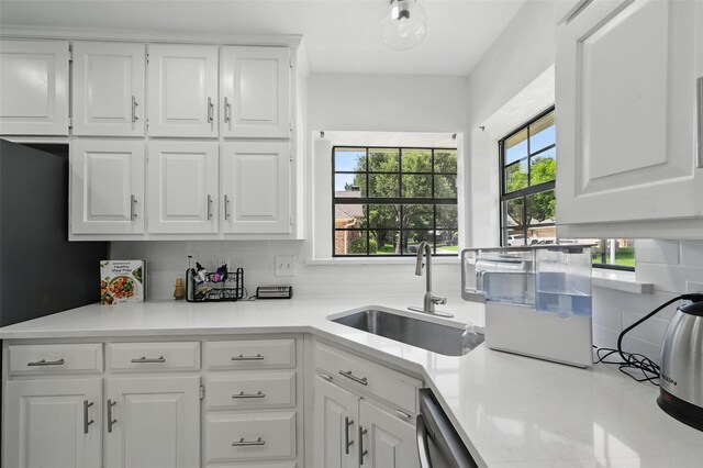 4003 Tuscany Ln, Arlington, TX 76016 - kitchen with decorative backsplash, white cabinetry, and light countertops