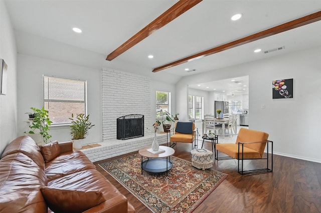 4003 Tuscany Ln, Arlington, TX 76016 - living room featuring wood finished floors, beamed ceiling, recessed lighting, and a brick fireplace