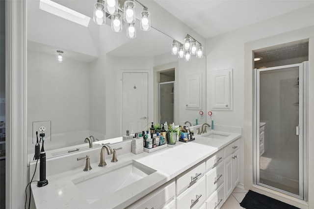 4003 Tuscany Ln, Arlington, TX 76016 - bathroom featuring a shower stall, double vanity, a skylight, and tile patterned floors