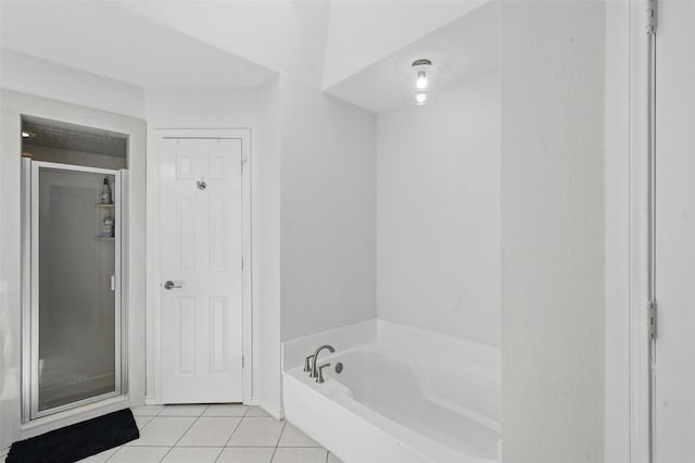4003 Tuscany Ln, Arlington, TX 76016 - bathroom featuring tile patterned floors and a garden tub