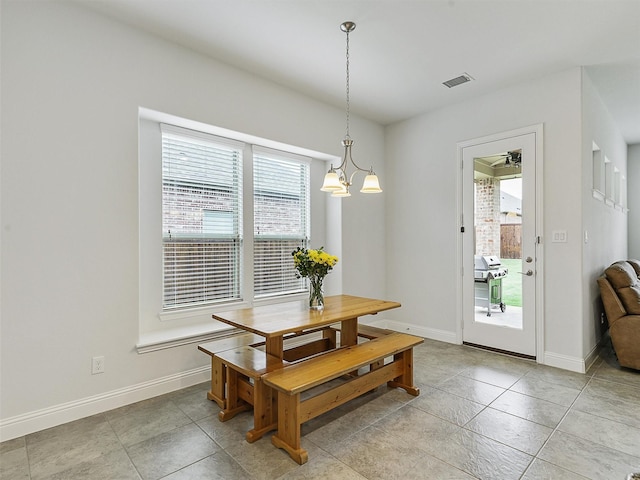 709 Providence, Wylie, TX 75098 - dining room featuring a chandelier and light tile patterned flooring