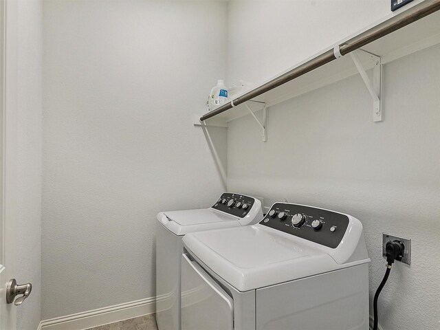 709 Providence, Wylie, TX 75098 - laundry area featuring washing machine and dryer and baseboards