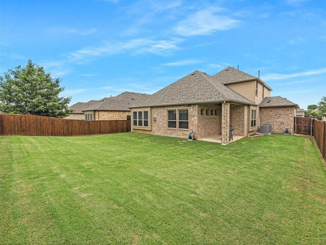 709 Providence, Wylie, TX 75098 - rear view of property with a fenced backyard, a patio area, brick siding, and a shingled roof