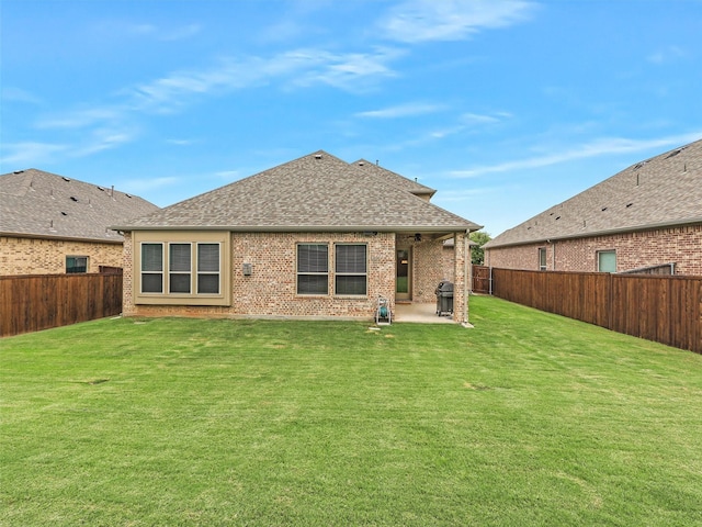 709 Providence, Wylie, TX 75098 - back of house with a patio area, roof with shingles, a fenced backyard, and brick siding