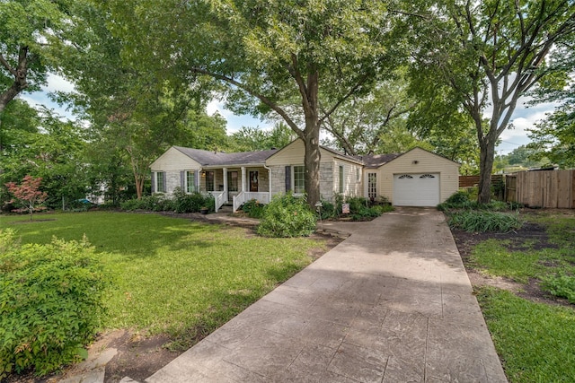 1312 Linden Ln, Garland, TX 75040 - ranch-style home with a porch, driveway, and a garage