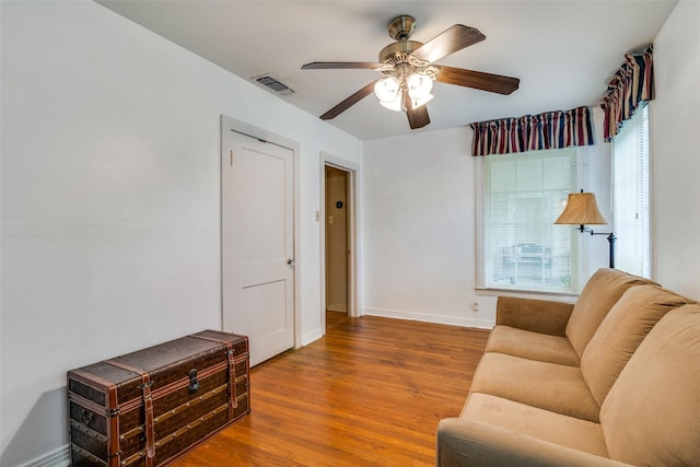 1312 Linden Ln, Garland, TX 75040 - living area with a ceiling fan and wood finished floors