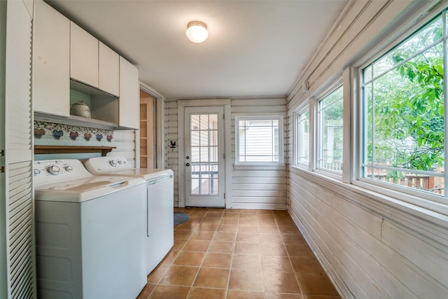 1312 Linden Ln, Garland, TX 75040 - washroom featuring cabinet space, washer and dryer, and tile patterned flooring